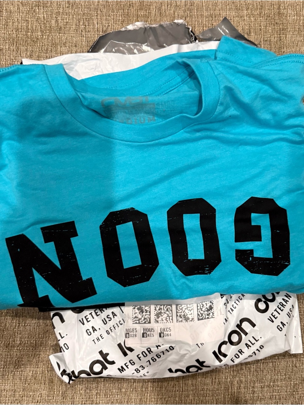 Combat Iron Turquoise Graphic Tee with Bold Blac